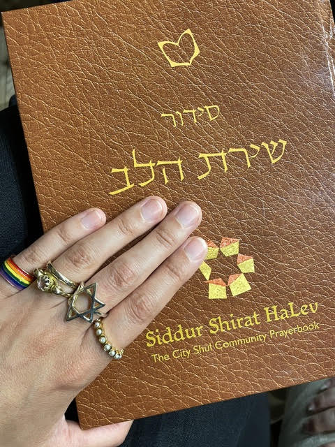 Cover of Shirat HaLev, City Shul’s siddur – a book outline containing the shape of a heart